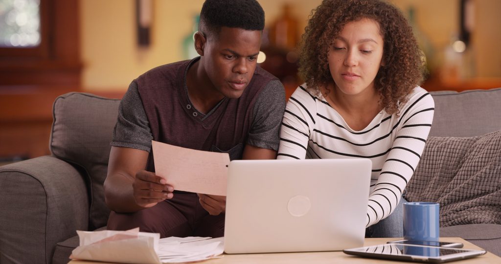 young couple looking at the computer